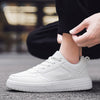 Plus size classic low-top white casual shoes for men with lace-up design, perfect for lightweight exercise and daily wear.