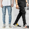 Fashionable men's multi-pocket tooling jeans in light blue and black, showcasing trendy streetwear style.