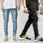 Fashionable men's multi-pocket tooling jeans in light blue and black, showcasing trendy streetwear style.