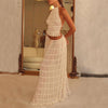 Model showcasing a sexy backless halter top and pleated long dress in white, perfect for social events.