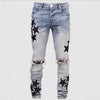 Men's slim stretch fashion jeans in light blue with star prints and distressed details, perfect for a trendy casual look.