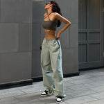 Fashion Trend Women's simple loose fitting pants in light green, styled for street hipster look with casual footwear.