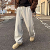 Men's casual elastic waist loose sweatpants in light gray, perfect for sports and daily wear.