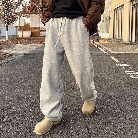 Men's casual elastic waist loose sweatpants in light gray, perfect for sports and daily wear.