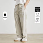 Beige elastic waist pants featuring tapered design, perfect for a casual stylish look in two colors.