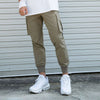 Men's khaki running workout pants with cargo pockets, paired with white sneakers, ideal for fitness and leisure activities.