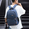 Man wearing a blue large capacity backpack, ideal for school, business, and outdoor use, featuring a stylish design.