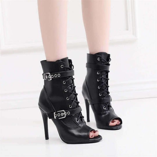 Black hollow Latin dance high heels with buckle and laces, stylish open toe design for women.