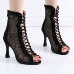 Black hollow Latin dance high heels with lace-up design and open toes, perfect for summer dancing.