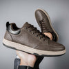Brown casual low top men's fashion shoes with flat heel and round toe, ideal for leisure wear.