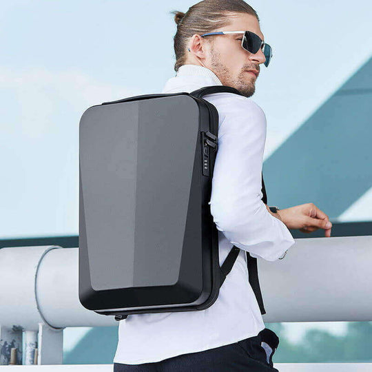 Business backpack in black, made of PC material, featuring a sleek hard case design, perfect for carrying computers.