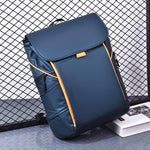 Business casual backpack in navy blue with contrasting orange accents, waterproof nylon, perfect for travel and urban style.