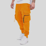 Men's casual orange cargo pants featuring ankle straps and pockets, perfect for hip-hop and street style.