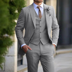 Men's classic 3-piece slim fit gray suit with blazer and vest, ideal for formal occasions.