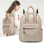 Stylish beige commuter backpack with multiple pockets, perfect for travel and everyday use.