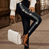 Commuter rhinestone small slit tight trousers in black, styled with a cozy sweater and chic handbag.