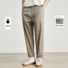 Cool khaki Tencel pants with waist buttons, casual summer style, available in two colors for men.