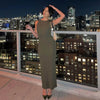 Woman wearing a Sleeveless Pencil Maxi Dress on a rooftop with city lights in the background, posing gracefully.
