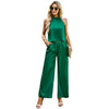 Green sleeveless jumpsuit for women, featuring a stylish design suitable for temperate commuting.