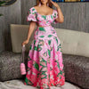 Pink floral dress with puffy sleeves and leaf patterns, perfect for casual outings or elegant events.