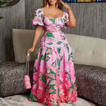 Pink floral dress with puffy sleeves and leaf patterns, perfect for casual outings or elegant events.