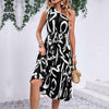 Stylish sleeveless black dress with white letter printing and pleated skirt, perfect for summer outings.