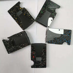 Collection of factory supply carbon fiber wallets in various colors, featuring a forged pattern and RFID card holder design.