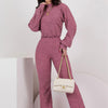 Fashion casual set in striped brown and red, round neck, featuring relaxed fit and stylish handbag.