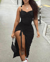 Drawstring Sling Dress in black with a metal buckle, featuring a drawstring waist and a stylish high slit.