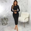 Model showcasing a black solid color tight two-piece set on a marble background, perfect for stylish casual wear.