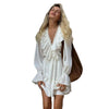 Woman wearing Y2K Flare-Sleeve V-Neck Mini Dress with dramatic sleeves and a puffy skirt.