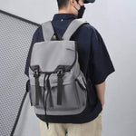 Gray large capacity travel backpack for men and women, waterproof nylon material with air pillow belt.