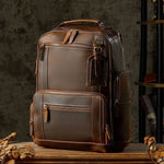 Handmade leather backpack in dark brown, featuring multiple pockets and a retro British style.