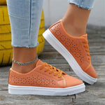 Hollow-out flat shoes with orange upper and white sole, perfect for leisure activities and available in multiple sizes.