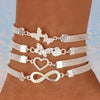 Stylish silver anklet set featuring butterfly and heart charms, perfect for a creative and retro look.