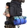Man carrying large capacity outdoor backpack, featuring multiple compartments and external gear attachments.