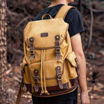 Large capacity waterproof outdoor canvas vintage backpack in khaki color, perfect for daily use and travel.