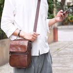 Leather men's vertical casual bag in brown, perfect for business commute or casual outings.