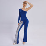 Stylish blue leg jumpsuit with one sleeve and flared design, featuring a sequin accent. Perfect for chic occasions.