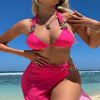 Light diamond solid color long skirt mesh three-piece swimsuit bikini in vibrant pink on beach.