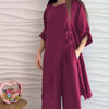 Loose-fitting wine red top with irregular hem and buttons, paired with wide-leg trousers, stylish women's fashion.