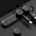 Magnetic cable organizer in sleek black design, managing multiple data and charger cables efficiently.