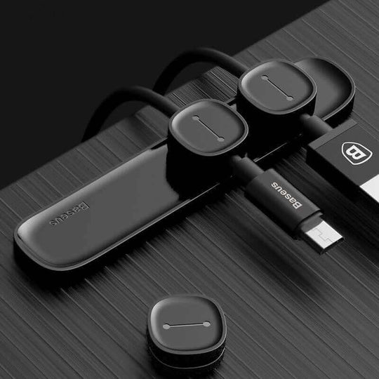 Magnetic cable organizer in sleek black design, managing multiple data and charger cables efficiently.