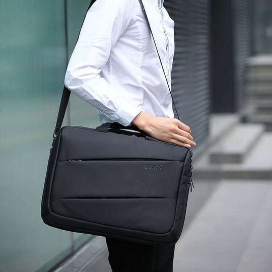 Men's business waterproof crossbody handbag in black, featuring a soft surface and padded shoulder strap.