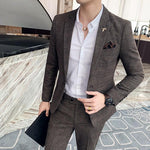 Men's casual plaid suit in brown, featuring slim fit design and stylish accessories, perfect for modern fashion.