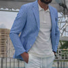 Men's loose striped suit jacket in sapphire blue with a casual white polo shirt, perfect for leisure wear.