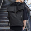 Men's large-capacity waterproof travel backpack in solid black, ideal for computer and outdoor use.