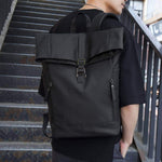 Men's large-capacity waterproof travel backpack in solid black, ideal for computer and outdoor use.
