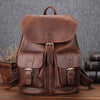 Men's leather large capacity leisure travel bag in brown, featuring multiple pockets and a vintage design.