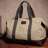 Men's large capacity shoulder crossbody canvas bag in khaki with dark brown accents, perfect for leisure travel.